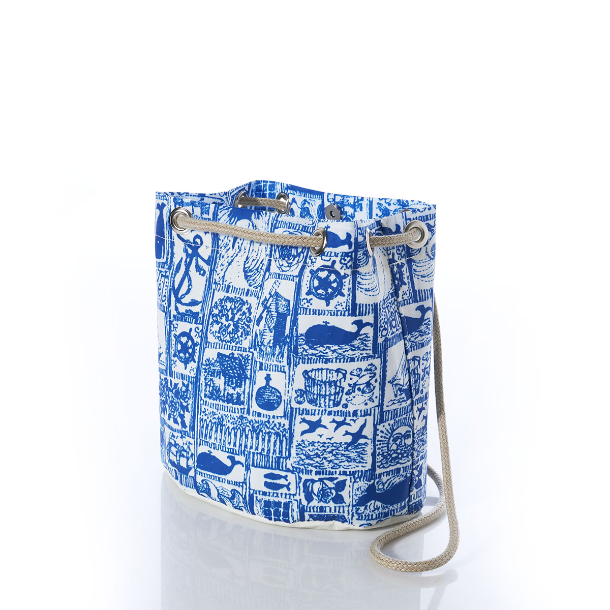 open top view of blue squares filled with various nautical imagery printed on recycled sail cloth convertible bucket bag with hemp dock line straps