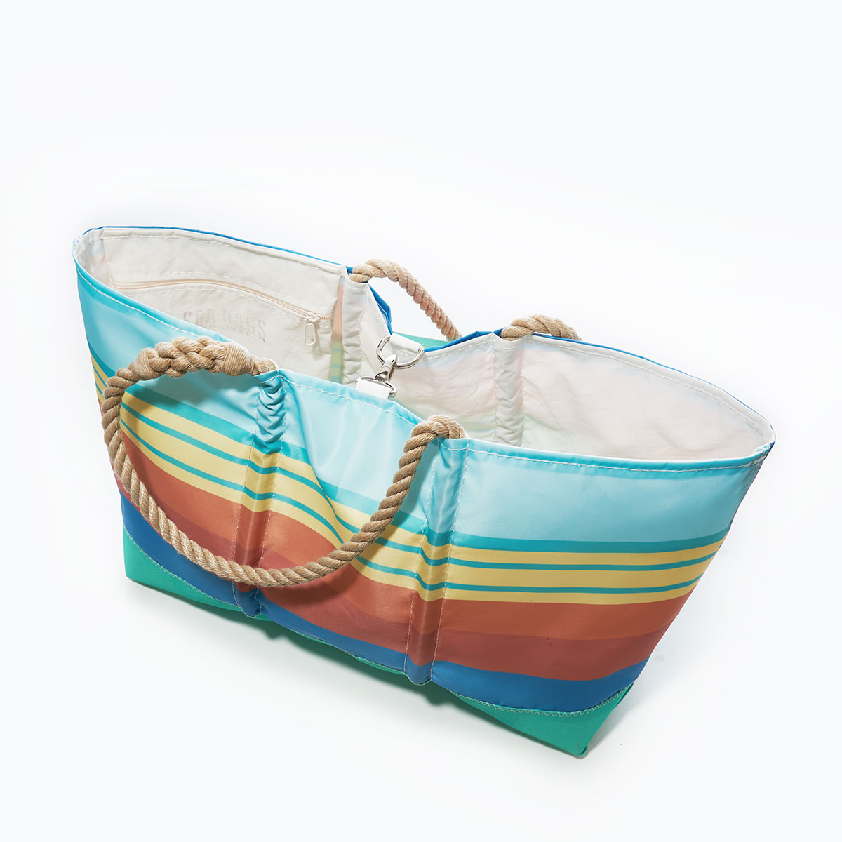 clasp closure on stripes in blue orange yellow and aquamarine printed on a recycled sail cloth beach tote with hemp rope handles