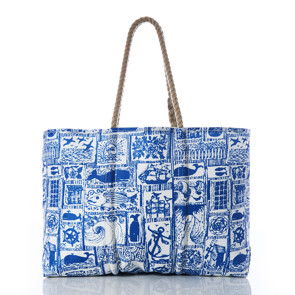 back view of blue squares filled with various nautical imagery printed on recycled sail cloth large tote with hemp rope handles