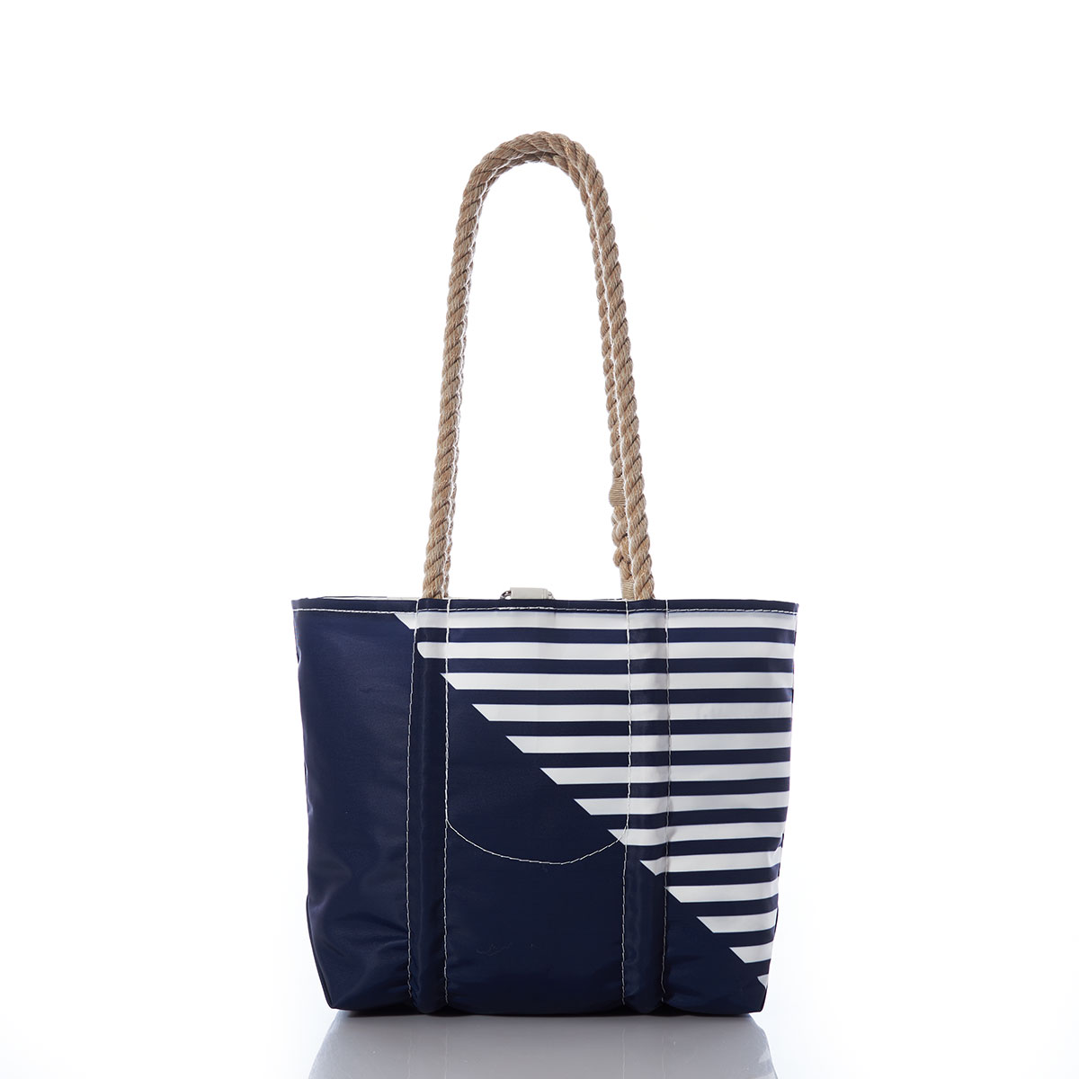 back view of a solid navy blue bottom right triangle and a navy and white striped top left triangle, printed on a recycled sail cloth tote with hemp rope handles