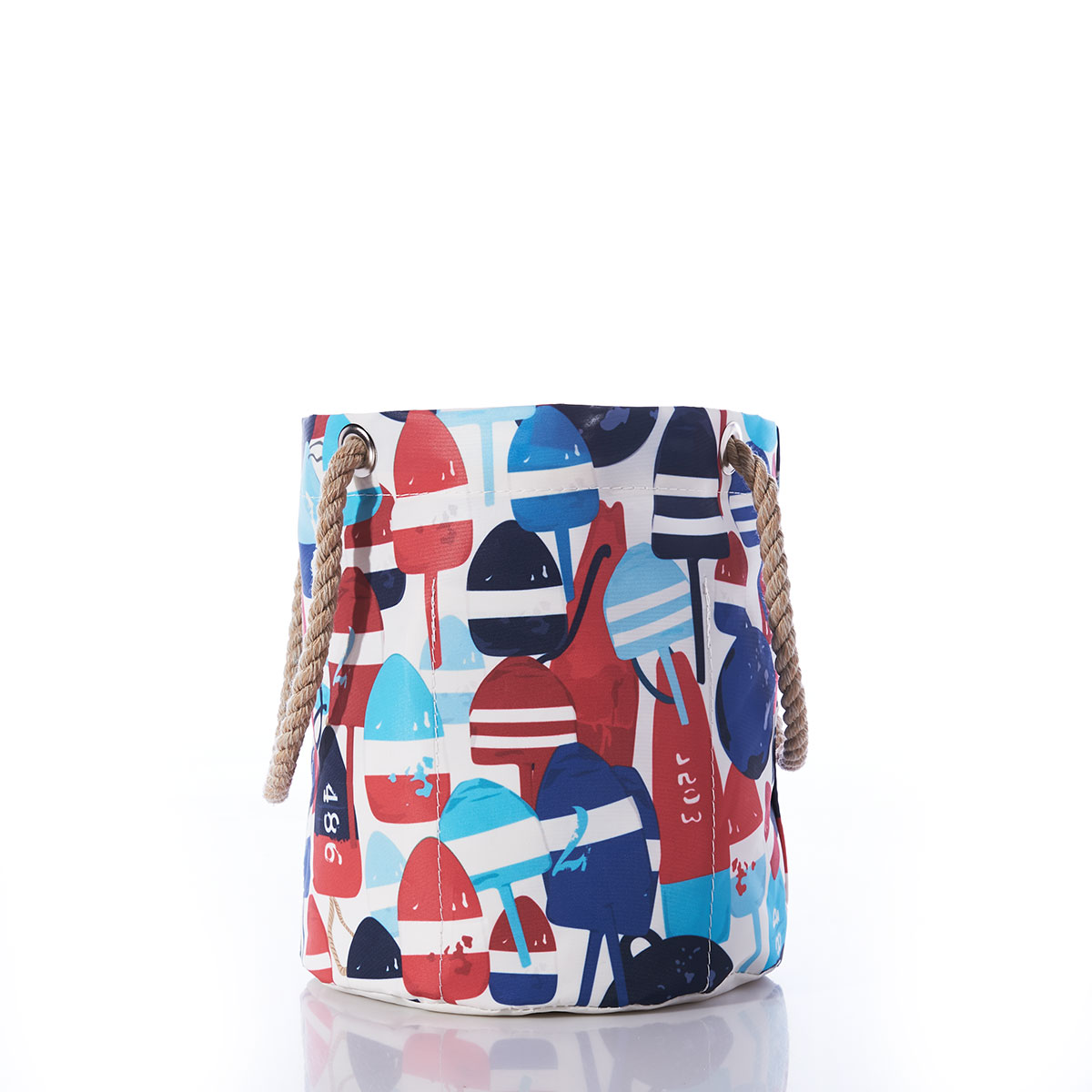 side view: a recycled sail cloth beverage bucket bag with hemp rope handles is emblazoned with a variety of printed buoys in reds and blues in different shapes and sizes