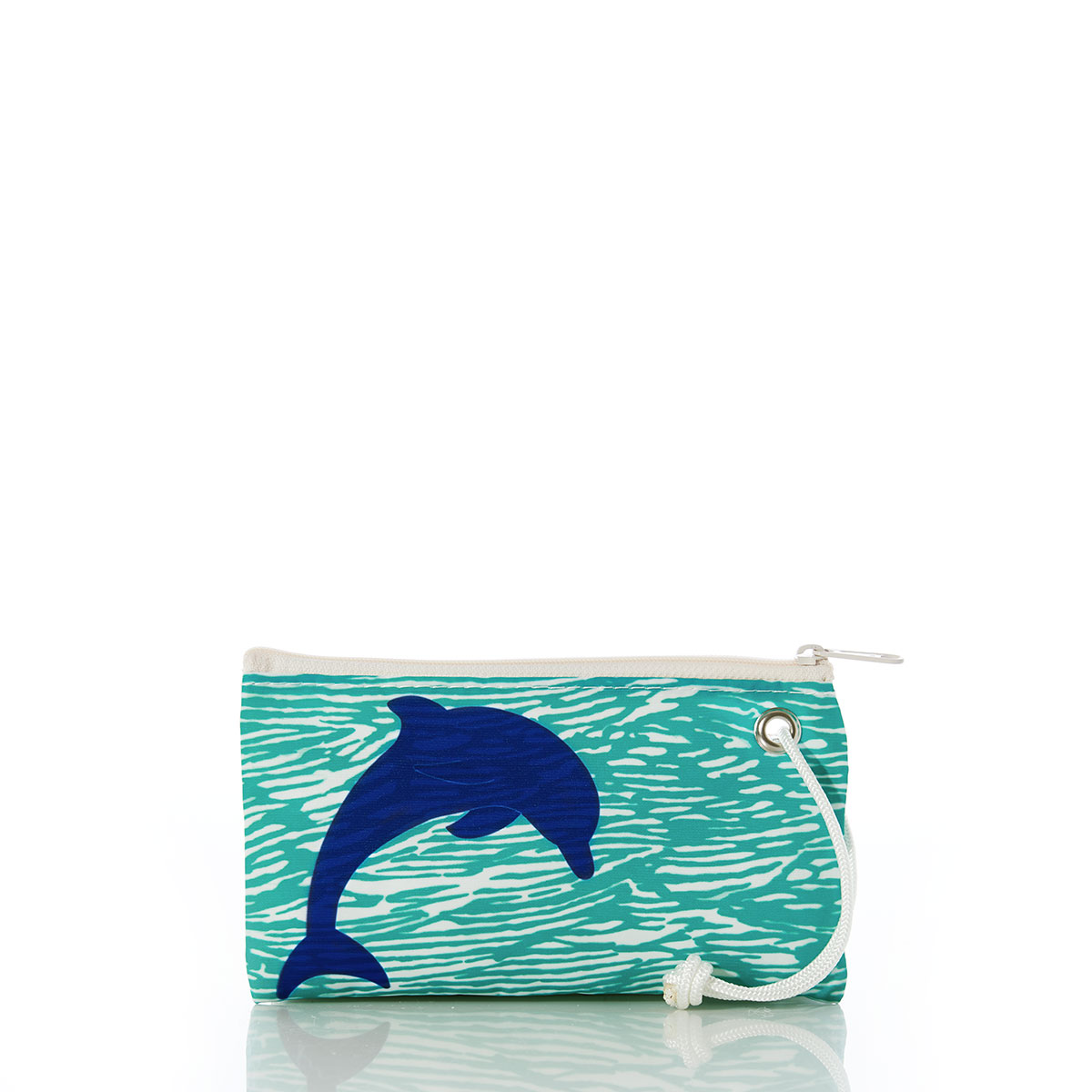 a curved blue dolphin sits on aquamarine waves printed on a recycled sail cloth wristlet with a navy zipper and wristlet strap