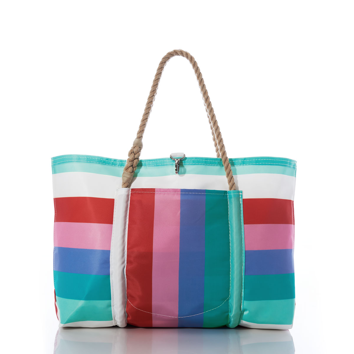 a recycled sail cloth pier tote with hemp rope handles and clasp closure is printed with bold stripes in shades of pinks and teals