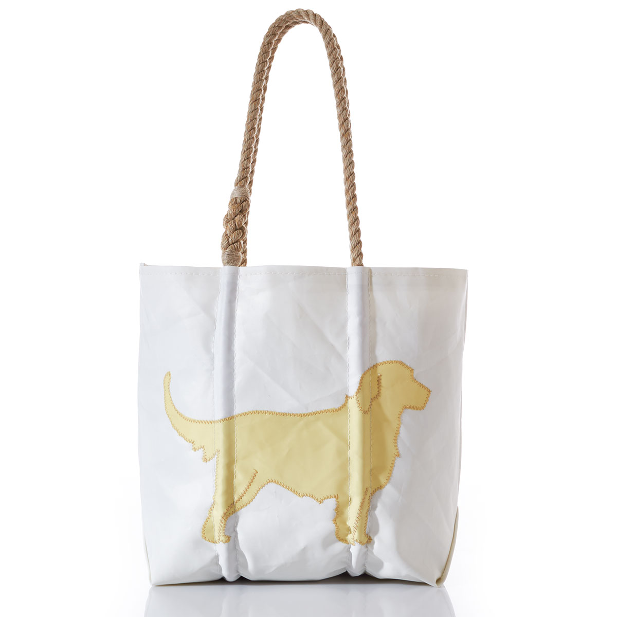 yellow applique in the shape of a golden retriever on a white recycled sail cloth tote with hemp rope handles