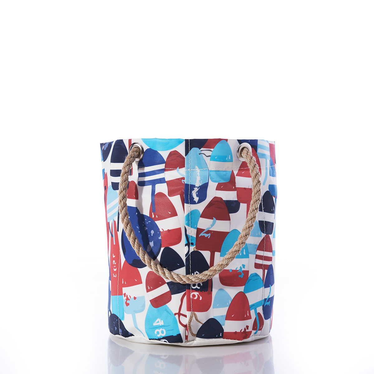 back view: a recycled sail cloth beverage bucket bag with hemp rope handles is emblazoned with a variety of printed buoys in reds and blues in different shapes and sizes