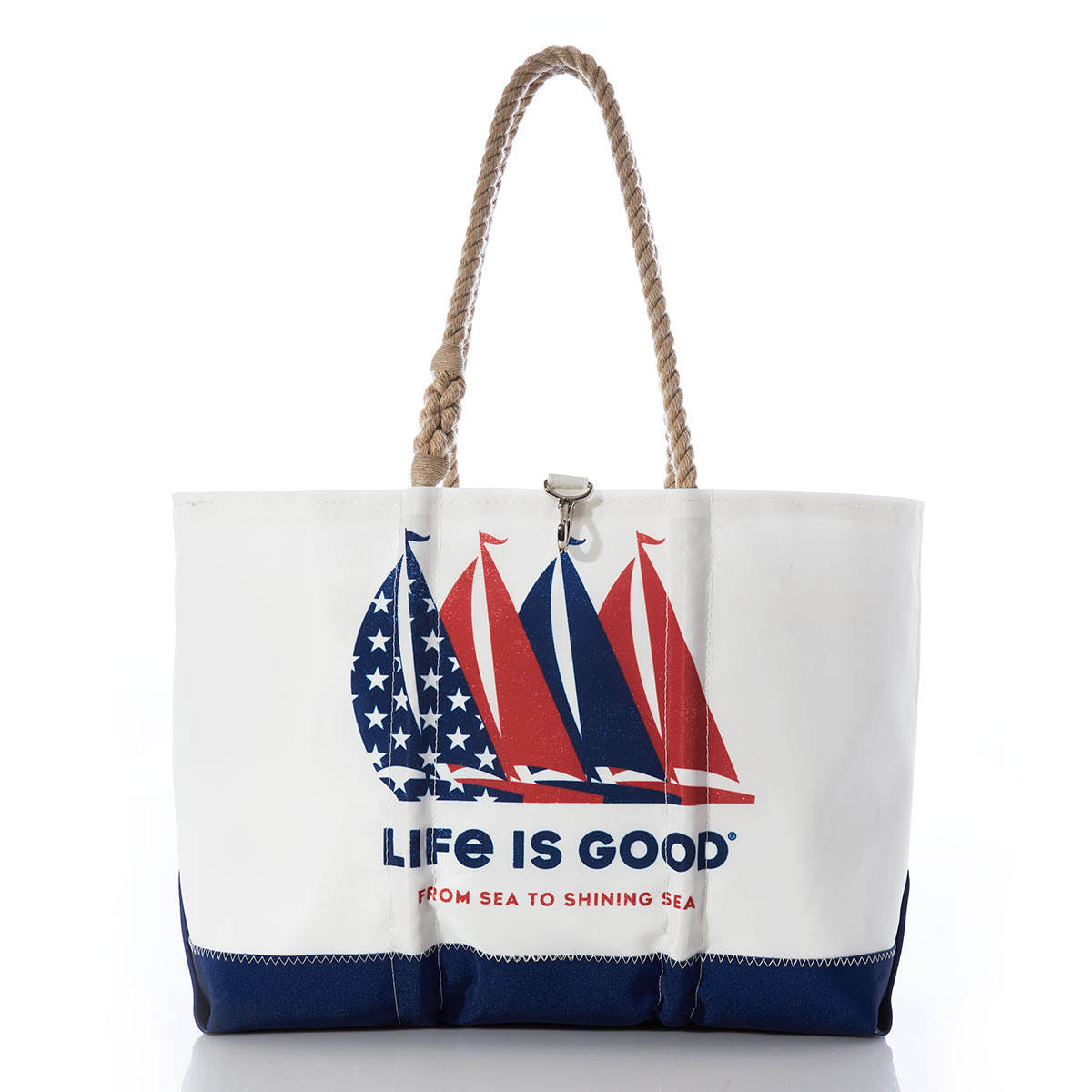 four sailboats in patriotic red and blue printed on white recycled sail cloth beach tote with navy bottom and hemp rope handles