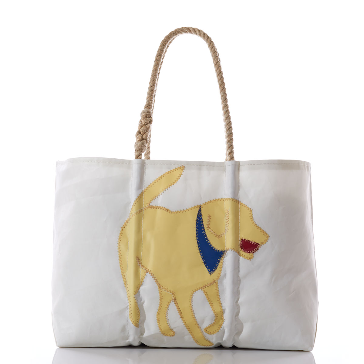 yellow lab applique with a blue bandana and red ball in his mouth on the front of a recycled sail cloth tote with hemp rope handles