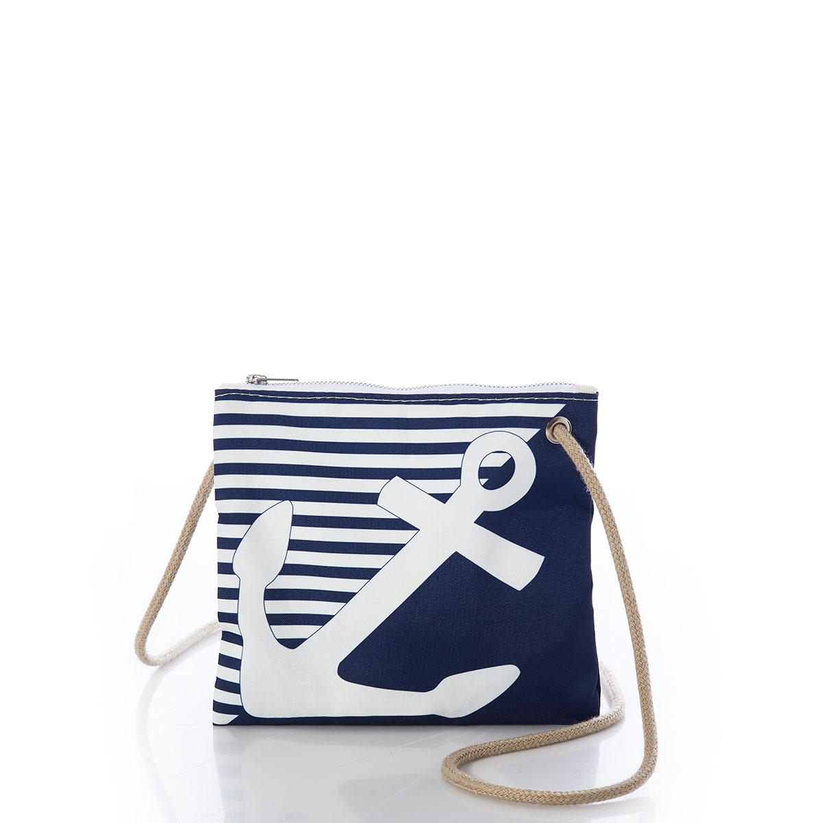 a white anchor divides a solid navy blue bottom right triangle and a navy and white striped top left triangle, printed on a recycled sail cloth crossbody bag with tan rope handle