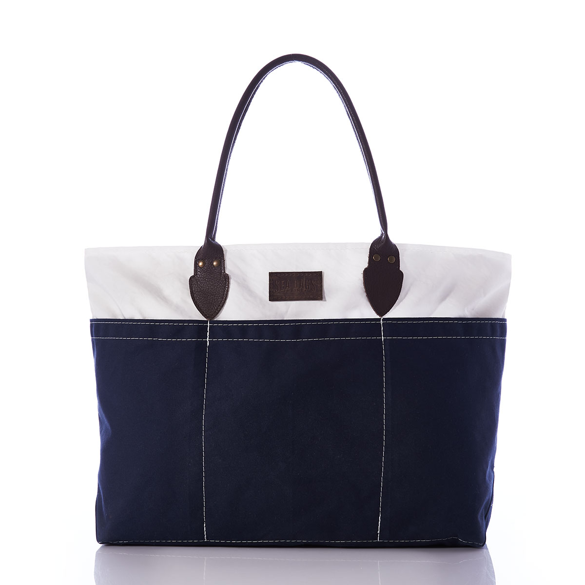 recycled sail cloth and navy canvas tote with rolled brown leather handles