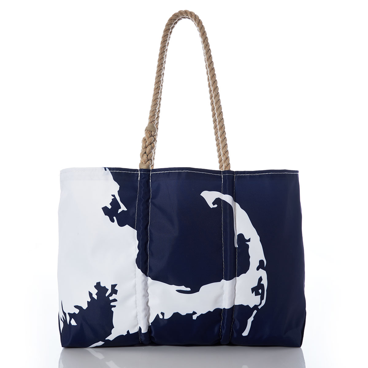 a recycled sail cloth tote with hemp handles is printed with a navy ocean next to a white coastline of Cape Cod