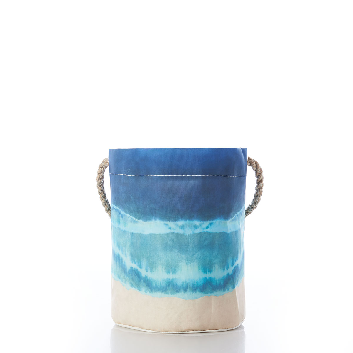 a recycled sail cloth bucket with hemp rope handle is printed in naturally formed stripes with a bottom tan, middle light blue, and top dark blue 