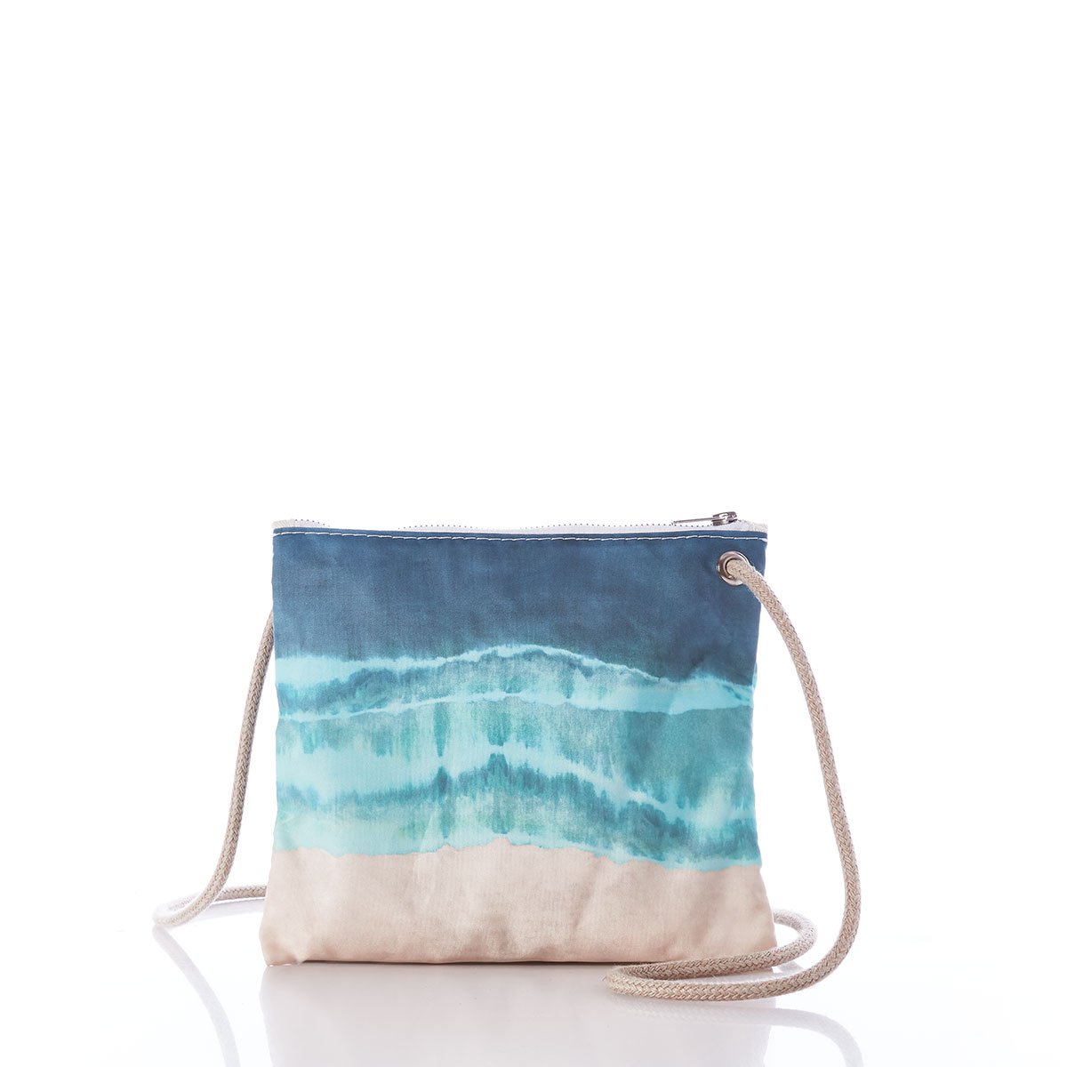 a recycled sail cloth crossbody bag with long rope strap is printed in naturally formed stripes with a bottom tan, middle light blue, and top dark blue 