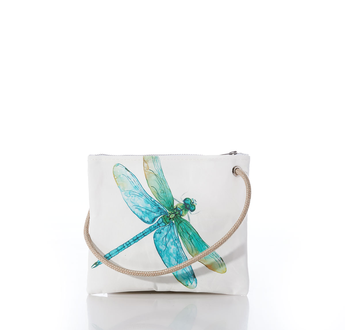 a dragonfly in light shades of blues and greens flies across a white recycled sail cloth crossbody bag with a tan braided dock line rope handle