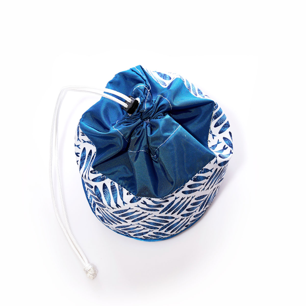 criss cross print of blue school of fish on recycled sail cloth ditty bag with drawstring