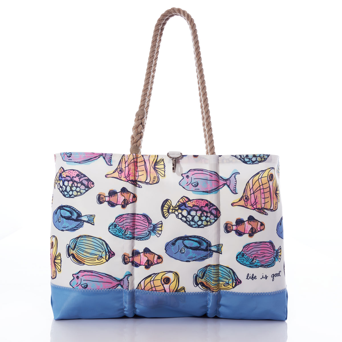 a white recycled sail cloth beach tote with hemp rope handles is printed with multicolor fish swimming