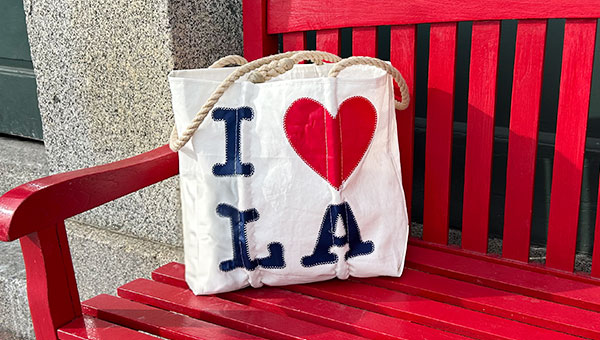 I Love LA Tote placed on a red bench